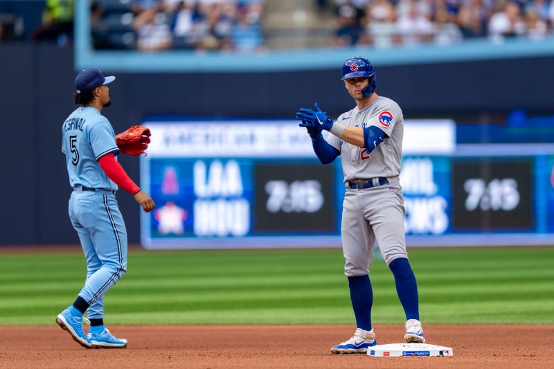 Aug 12, 2023; Toronto, Ontario, CAN; Chicago Cubs second baseman Nico Hoerner (2) celebrates after hitting a double against the Toronto Blue Jays during the fourth inning at Rogers Centre. Mandatory Credit: Kevin Sousa-USA TODAY Sports