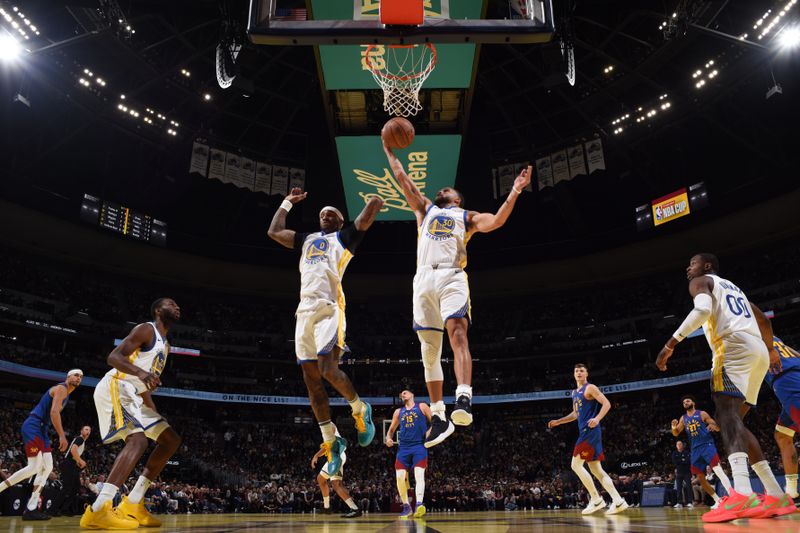 DENVER, CO - DECEMBER 3: Stephen Curry #30 of the Golden State Warriors goes up for the rebound during the game against the Denver Nuggets during the Emirates NBA Cup on December 3, 2024 at Ball Arena in Denver, Colorado. NOTE TO USER: User expressly acknowledges and agrees that, by downloading and/or using this Photograph, user is consenting to the terms and conditions of the Getty Images License Agreement. Mandatory Copyright Notice: Copyright 2024 NBAE (Photo by Garrett Ellwood/NBAE via Getty Images)