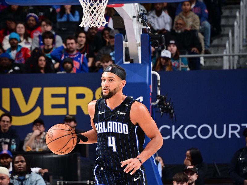 DETROIT, MI - JANUARY 1: Jalen Suggs #4 of the Orlando Magic dribbles the ball during the game against the Detroit Pistons on January 1, 2025 at Little Caesars Arena in Detroit, Michigan. NOTE TO USER: User expressly acknowledges and agrees that, by downloading and/or using this photograph, User is consenting to the terms and conditions of the Getty Images License Agreement. Mandatory Copyright Notice: Copyright 2025 NBAE (Photo by Chris Schwegler/NBAE via Getty Images)