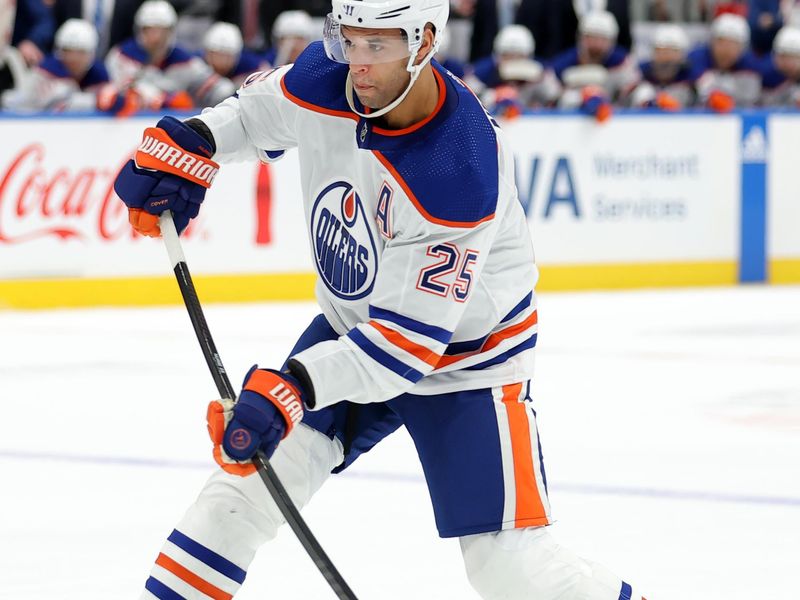 Dec 19, 2023; Elmont, New York, USA; Edmonton Oilers defenseman Darnell Nurse (25) takes a shot against the New York Islanders during the third period at UBS Arena. Mandatory Credit: Brad Penner-USA TODAY Sports