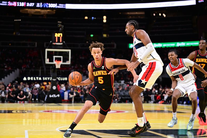 ATLANTA, GA - NOVEMBER 15:  Dyson Daniels #5 of the Atlanta Hawks drives to the basket during the game against the Washington Wizards during the Emirates NBA Cup game on November 15, 2024 at State Farm Arena in Atlanta, Georgia.  NOTE TO USER: User expressly acknowledges and agrees that, by downloading and/or using this Photograph, user is consenting to the terms and conditions of the Getty Images License Agreement. Mandatory Copyright Notice: Copyright 2024 NBAE (Photo by Adam Hagy/NBAE via Getty Images)