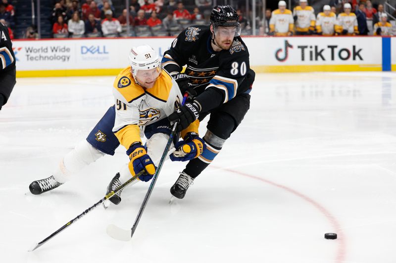 Nov 6, 2024; Washington, District of Columbia, USA; Nashville Predators center Steven Stamkos (91) and Washington Capitals left wing Pierre-Luc Dubois (80) battle for the puck in the second period at Capital One Arena. Mandatory Credit: Geoff Burke-Imagn Images