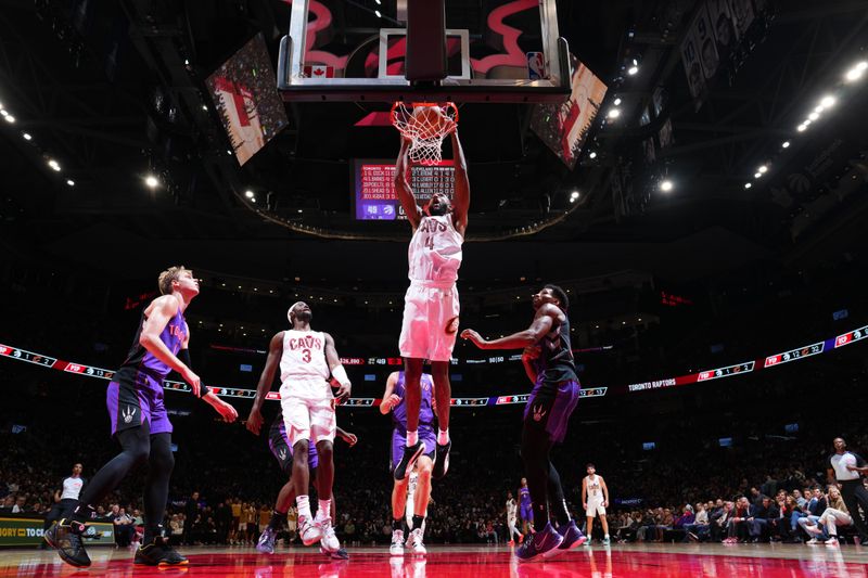 TORONTO, CANADA - OCTOBER 23: Evan Mobley #4 of the Cleveland Cavaliers dunks the ball during the game against the Toronto Raptors on October 23, 2024 at the Scotiabank Arena in Toronto, Ontario, Canada.  NOTE TO USER: User expressly acknowledges and agrees that, by downloading and or using this Photograph, user is consenting to the terms and conditions of the Getty Images License Agreement.  Mandatory Copyright Notice: Copyright 2024 NBAE (Photo by Mark Blinch/NBAE via Getty Images)