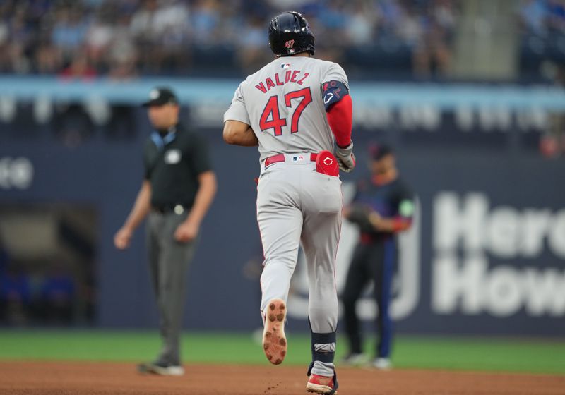 Jun 19, 2024; Toronto, Ontario, CAN; Boston Red Sox second base Enmanuel Valdez (47) runs the bases after hitting a home run against the Toronto Blue Jays during fourth inning at Rogers Centre. Mandatory Credit: Nick Turchiaro-USA TODAY Sports