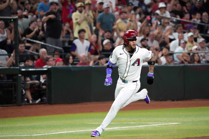 Jul 13, 2024; Phoenix, Arizona, USA; Arizona Diamondbacks second base Ketel Marte (4) rounds third base and scores a run against the Toronto Blue Jays during the first inning at Chase Field. Mandatory Credit: Joe Camporeale-USA TODAY Sports