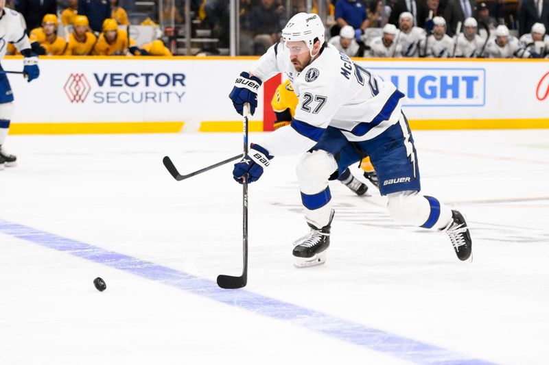 Nov 29, 2024; Nashville, Tennessee, USA;  Tampa Bay Lightning defenseman Ryan McDonagh (27) skates with the puck against the Nashville Predators during the third period at Bridgestone Arena. Mandatory Credit: Steve Roberts-Imagn Images