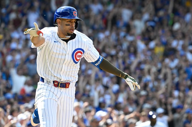 May 18, 2024; Chicago, Illinois, USA; Chicago Cubs third base Christopher Morel (5) signals after he hits a game winning RBI single against the Pittsburgh Pirates during the ninth inning at Wrigley Field. Mandatory Credit: Matt Marton-USA TODAY Sports