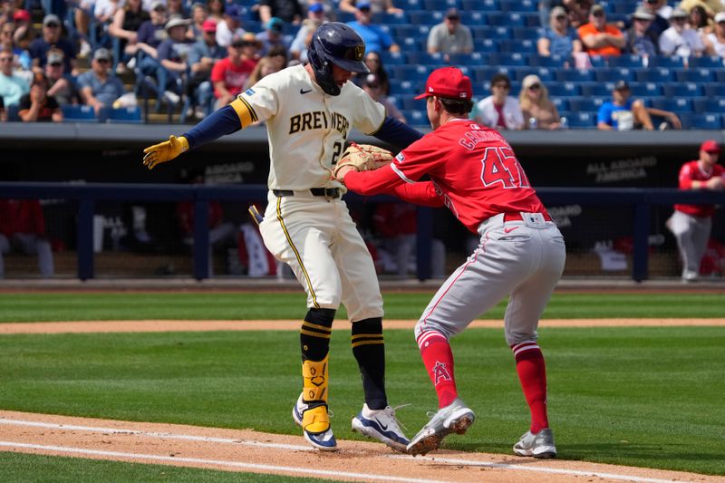 Mar 18, 2024; Phoenix, Arizona, USA; Los Angeles Angels starting pitcher Griffin Canning (47) tags out Milwaukee Brewers second baseman Brice Turang (2) in the second inning at American Family Fields of Phoenix. Mandatory Credit: Rick Scuteri-USA TODAY Sports