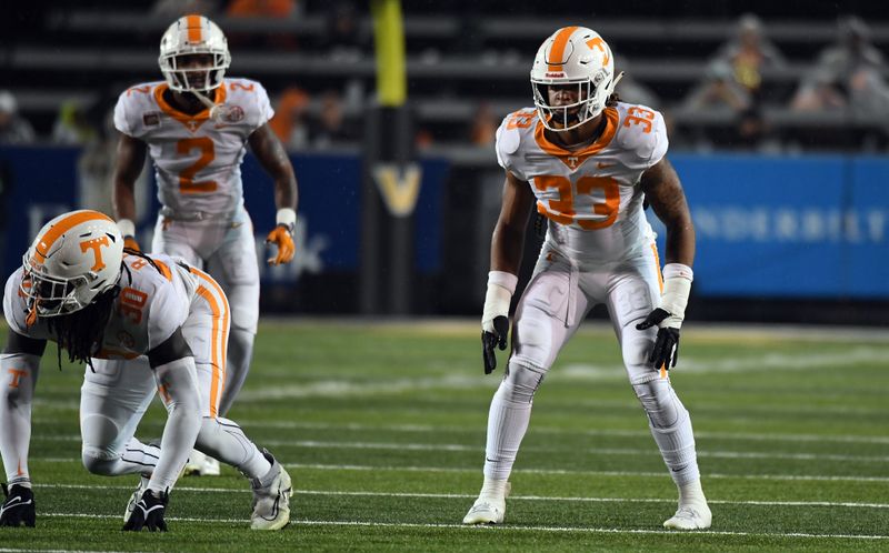 Nov 26, 2022; Nashville, Tennessee, USA; Tennessee Volunteers linebacker Jeremy Banks (33) waits for the snap during the first half against the Vanderbilt Commodores at FirstBank Stadium. Mandatory Credit: Christopher Hanewinckel-USA TODAY Sports