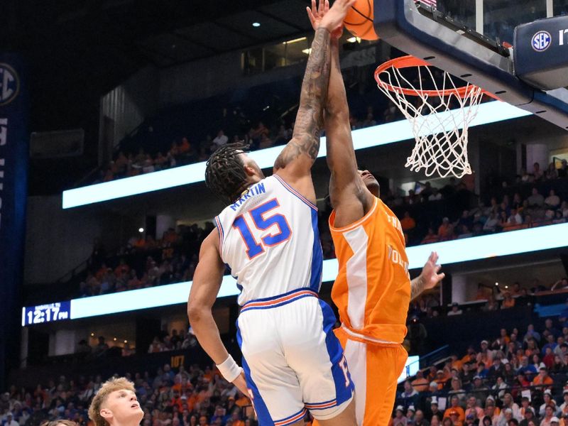 Mar 16, 2025; Nashville, TN, USA; Florida Gators guard Alijah Martin (15) does in for a dunk against Tennessee Volunteers guard Darlinstone Dubar (8) in the first half during the 2025 SEC Championship Game at Bridgestone Arena. Mandatory Credit: Steve Roberts-Imagn Images