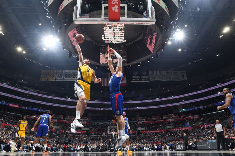 LOS ANGELES, CA - MARCH 25: T.J. McConnell #9 of the Indiana Pacers drives to the basket during the game against the LA Clippers on March 25, 2024 at Crypto.Com Arena in Los Angeles, California. NOTE TO USER: User expressly acknowledges and agrees that, by downloading and/or using this Photograph, user is consenting to the terms and conditions of the Getty Images License Agreement. Mandatory Copyright Notice: Copyright 2024 NBAE (Photo by Adam Pantozzi/NBAE via Getty Images)