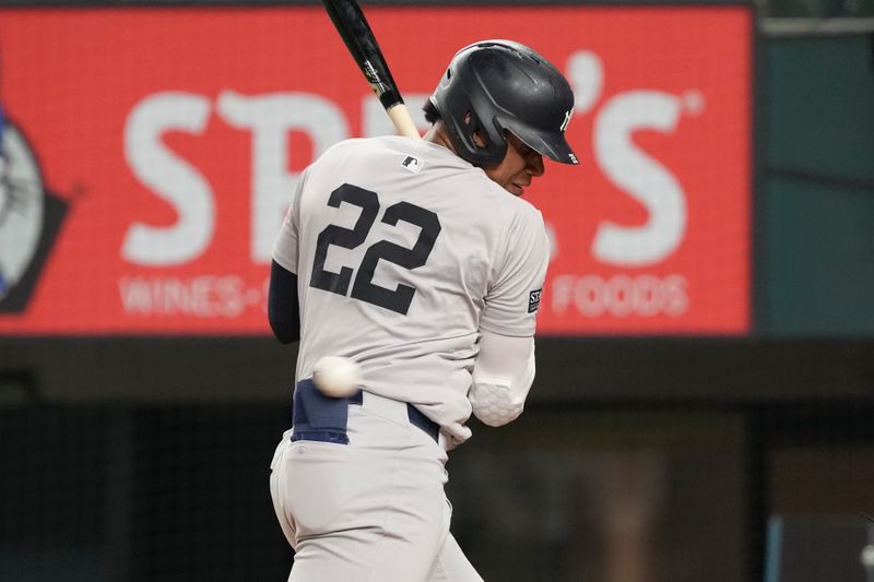 Sep 3, 2024; Arlington, Texas, USA; New York Yankees right fielder Juan Soto (22) is hit by a pitch thrown by Texas Rangers starting pitcher Andrew Heaney (not shown) during the fifth inning at Globe Life Field. Mandatory Credit: Jim Cowsert-Imagn Images