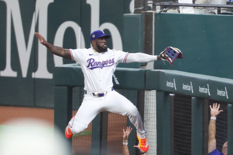 Jul 2, 2024; Arlington, Texas, USA;  Texas Rangers right fielder Adolis Garcia (53) leaps for but cannot catch a foul ball during the game against the San Diego Padres at Globe Life Field. Mandatory Credit: Kevin Jairaj-USA TODAY Sports