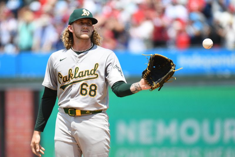 Jul 14, 2024; Philadelphia, Pennsylvania, USA; Oakland Athletics pitcher Joey Estes (68) gets a new baseball after allowing a home run during the first inning against the Philadelphia Phillies at Citizens Bank Park. Mandatory Credit: Eric Hartline-USA TODAY Sports