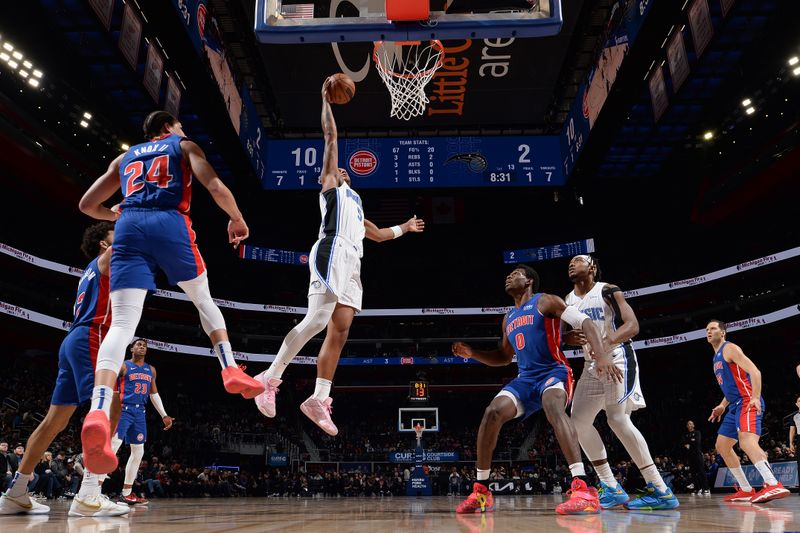 DETROIT, MI - FEBRUARY 4: Paolo Banchero #5 of the Orlando Magic drives to the basket during the game  against the Detroit Pistons on February 4, 2024 at Little Caesars Arena in Detroit, Michigan. NOTE TO USER: User expressly acknowledges and agrees that, by downloading and/or using this photograph, User is consenting to the terms and conditions of the Getty Images License Agreement. Mandatory Copyright Notice: Copyright 2024 NBAE (Photo by Chris Schwegler/NBAE via Getty Images)