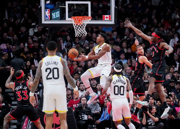 TORONTO, ON - DECEMBER 23: Ochai Agbaji #30 of the Utah Jazz goes to the basket against the Toronto Raptors during the first half of their basketball game at the Scotiabank Arena on December 23, 2023 in Toronto, Ontario, Canada. NOTE TO USER: User expressly acknowledges and agrees that, by downloading and/or using this Photograph, user is consenting to the terms and conditions of the Getty Images License Agreement. (Photo by Mark Blinch/Getty Images)