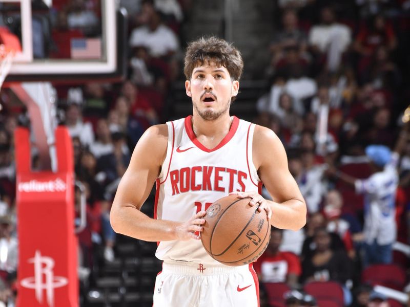 HOUSTON, TX - OCTOBER 15: Reed Sheppard #15 of the Houston Rockets handles the ball during the game against the New Orleans Pelicans during a NBA preseason game on October 15, 2024 at the Toyota Center in Houston, Texas. NOTE TO USER: User expressly acknowledges and agrees that, by downloading and or using this photograph, User is consenting to the terms and conditions of the Getty Images License Agreement. Mandatory Copyright Notice: Copyright 2024 NBAE (Photo by Logan Riely/NBAE via Getty Images)