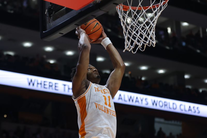 Feb 17, 2024; Knoxville, Tennessee, USA; Tennessee Volunteers forward Tobe Awaka (11) dunks the ball against the Vanderbilt Commodores during the second half at Thompson-Boling Arena at Food City Center. Mandatory Credit: Randy Sartin-USA TODAY Sports