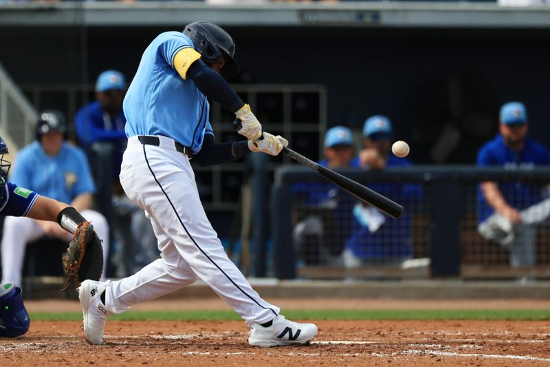 Feb 27, 2026; Port Charlotte, Florida, USA; Tampa Bay Rays center fielder Cedric Mullins (31) hits a solo home run during the third inning against the Toronto Blue Jays at Charlotte Sports Park. Mandatory Credit: Kim Klement Neitzel-Imagn Images