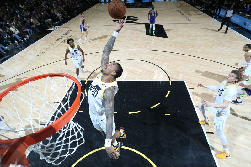 SALT LAKE CITY, UT - FEBRUARY 15: John Collins #20 of the Utah Jazz grabs the rebound during the game against the Golden State Warriors on February 15, 2024 at Delta Center in Salt Lake City, Utah. NOTE TO USER: User expressly acknowledges and agrees that, by downloading and or using this Photograph, User is consenting to the terms and conditions of the Getty Images License Agreement. Mandatory Copyright Notice: Copyright 2024 NBAE (Photo by Melissa Majchrzak/NBAE via Getty Images)