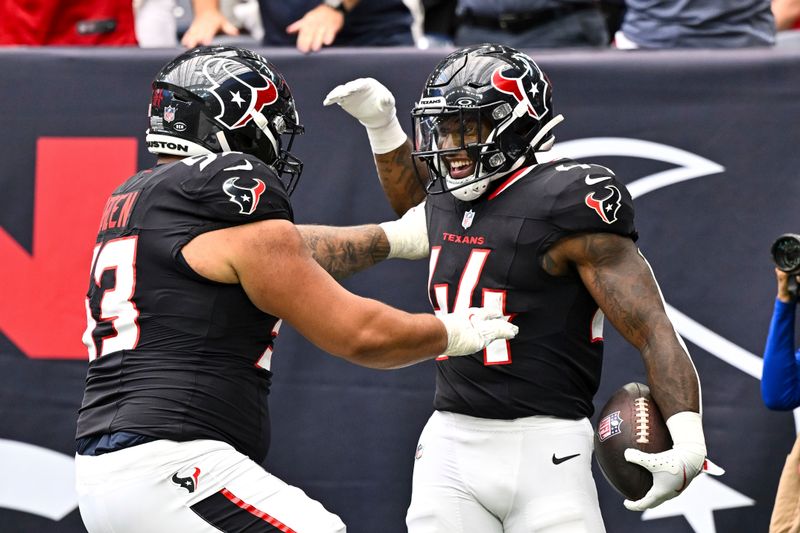 Houston Texans running back British Brooks (44) celebrates after scoring a touchdown during the fourth quarter against the New York Giants during an NFL preseason football game, Saturday, Aug 17, 2024 in Houston. (AP Photo/Maria Lysaker)