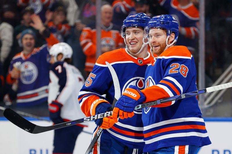 Jan 23, 2024; Edmonton, Alberta, CAN; The Edmonton Oilers celebrate a goal scored by forward Dylan Holloway (55) during the third period against the Columbus Blue Jackets at Rogers Place. Mandatory Credit: Perry Nelson-USA TODAY Sports