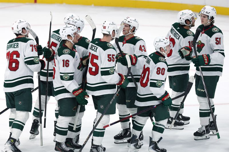 Sep 21, 2025; Winnipeg, Manitoba, CAN; Minnesota Wild celebrate their victory over the Winnipeg Jets at Canada Life Centre. Mandatory Credit: James Carey Lauder-Imagn Images