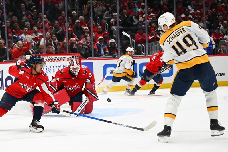 Feb 5, 2026; Washington, District of Columbia, USA; Washington Capitals goaltender Logan Thompson (48) saves the shot by Nashville Predators left wing Reid Schaefer (49) during the second period at Capital One Arena. Mandatory Credit: Brad Mills-Imagn Images