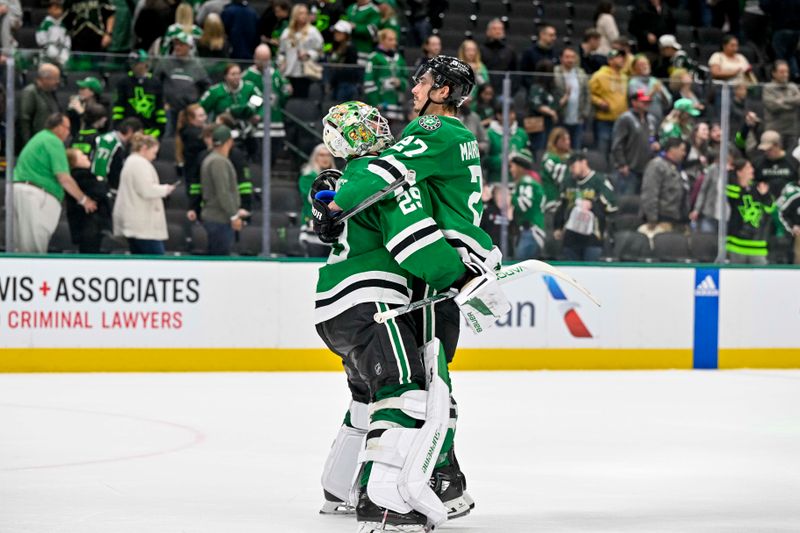 Apr 9, 2024; Dallas, Texas, USA; Dallas Stars goaltender Jake Oettinger (29) and left wing Mason Marchment (27) celebrate on the ice after the Stars defeat the Buffalo Sabres at the American Airlines Center. Mandatory Credit: Jerome Miron-USA TODAY Sports