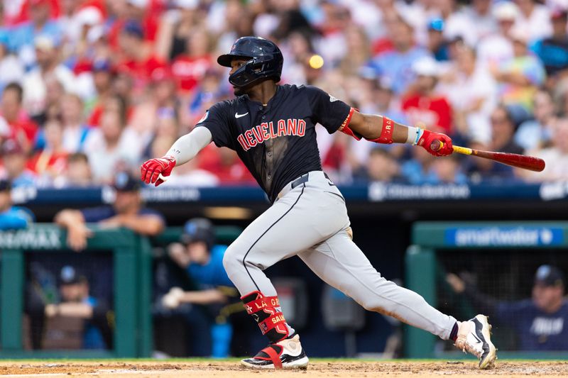 Jul 26, 2024; Philadelphia, Pennsylvania, USA; Cleveland Guardians third base Angel Martínez (1) hits an RBI single during the fourth inning against the Philadelphia Phillies at Citizens Bank Park. Mandatory Credit: Bill Streicher-USA TODAY Sports