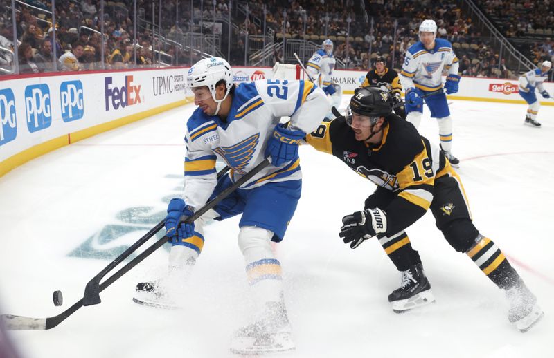 Oct 27, 2025; Pittsburgh, Pennsylvania, USA; St. Louis Blues right wing Jordan Kyrou (25) handles the puck against pressure from Pittsburgh Penguins center Connor Dewar (19) during the third period at PPG Paints Arena. Mandatory Credit: Charles LeClaire-Imagn Images