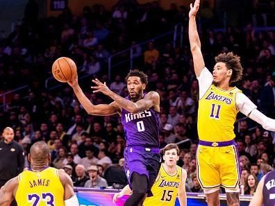 LOS ANGELES, CA - NOVEMBER 15: Malik Monk #0 of the Sacramento Kings passes the ball during the game against the Los Angeles Lakers on November 15, 2023 at Crypto.Com Arena in Los Angeles, California. NOTE TO USER: User expressly acknowledges and agrees that, by downloading and/or using this Photograph, user is consenting to the terms and conditions of the Getty Images License Agreement. Mandatory Copyright Notice: Copyright 2023 NBAE (Photo by Tyler Ross/NBAE via Getty Images)