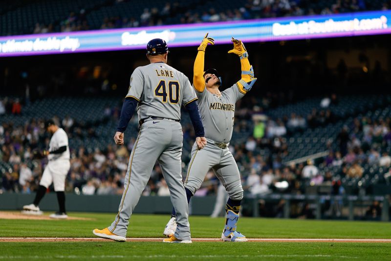 Apr 9, 2025; Denver, Colorado, USA; Milwaukee Brewers catcher William Contreras (24) celebrates ahead of third base coach Jason Lane (40) as he rounds the bases on a two run home run in the third inning against the Colorado Rockies at Coors Field. Mandatory Credit: Isaiah J. Downing-Imagn Images