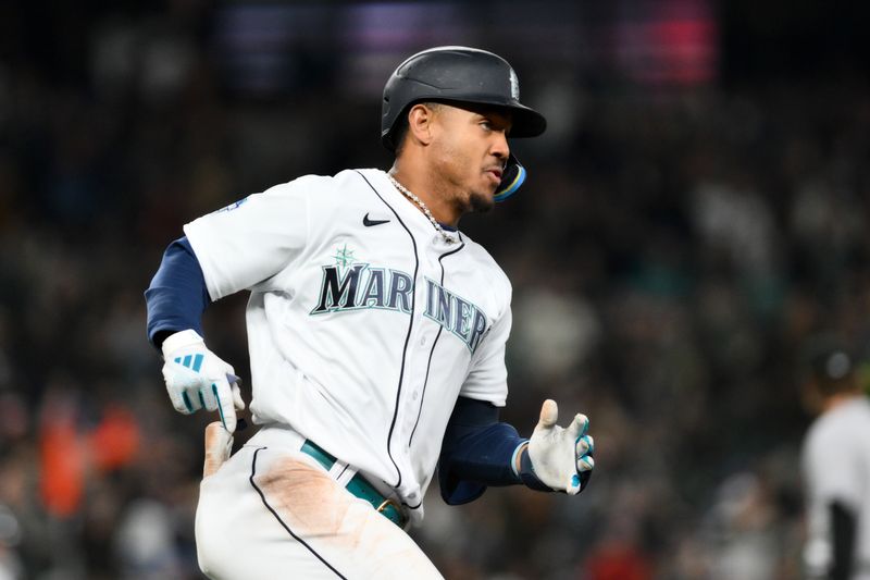 Apr 15, 2023; Seattle, Washington, USA; Seattle Mariners center fielder Julio Rodriguez (44) runs towards first base after hitting a 3-RBI triple against the Colorado Rockies during the fourth inning at T-Mobile Park. Mandatory Credit: Steven Bisig-USA TODAY Sports