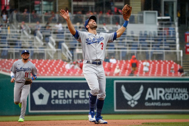 Sep 10, 2023; Washington, District of Columbia, USA; Los Angeles Dodgers third baseman Chris Taylor (3) calls a fly ball in the fourth inning against the Washington Nationals at Nationals Park. Mandatory Credit: Amber Searls-USA TODAY Sports