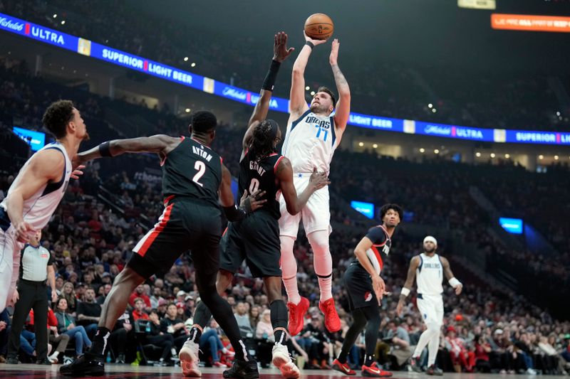 PORTLAND, OREGON - DECEMBER 01: Luka Doncic #77 of the Dallas Mavericks shoots the ball over Jerami Grant #9 of the Portland Trail Blazers during the first half at Moda Center on December 01, 2024 in Portland, Oregon. NOTE TO USER: User expressly acknowledges and agrees that, by downloading and or using this photograph, User is consenting to the terms and conditions of the Getty Images License Agreement. (Photo by Soobum Im/Getty Images)