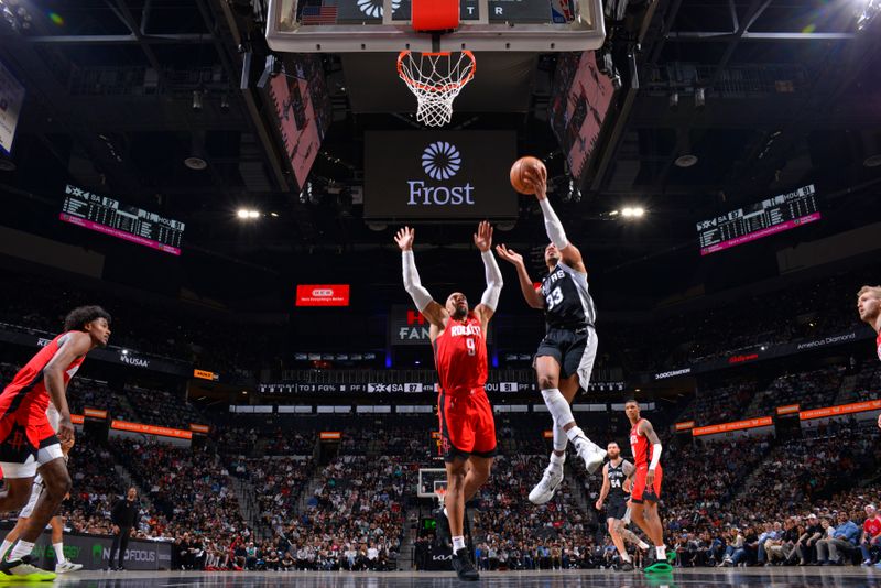 SAN ANTONIO, TX - MARCH 12: Tre Jones #33 of the San Antonio Spurs drives to the basket during the game against the Houston Rockets on March 12, 2024 at the Frost Bank Center in San Antonio, Texas. NOTE TO USER: User expressly acknowledges and agrees that, by downloading and or using this photograph, user is consenting to the terms and conditions of the Getty Images License Agreement. Mandatory Copyright Notice: Copyright 2024 NBAE (Photos by Jesse D. Garrabrant/NBAE via Getty Images)