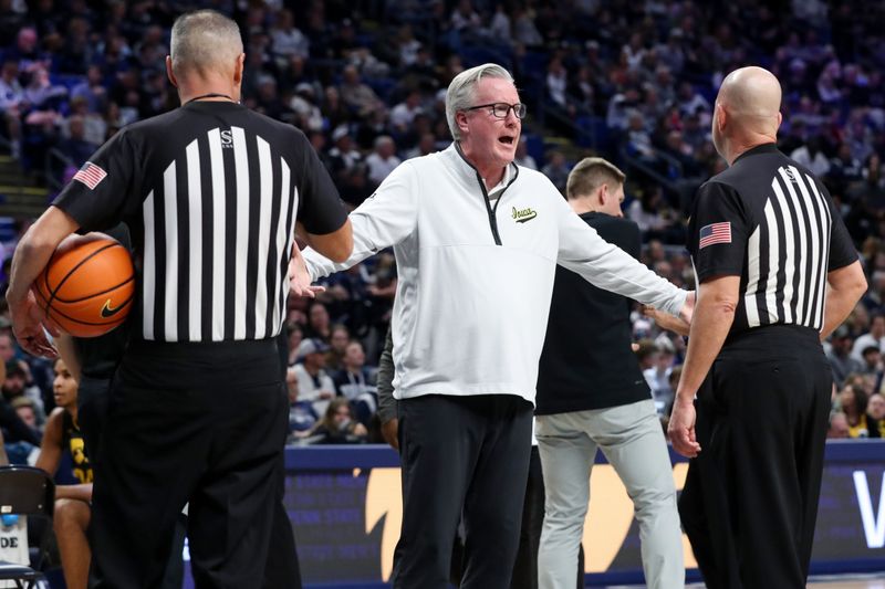 Jan 1, 2023; University Park, Pennsylvania, USA; Iowa Hawkeyes head coach Fran McCaffery argues a call with the officials during a timeout during the first half against the Penn State Nittany Lions at Bryce Jordan Center. Mandatory Credit: Matthew OHaren-USA TODAY Sports