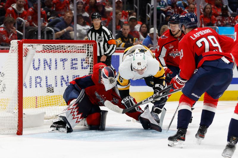 Nov 8, 2024; Washington, District of Columbia, USA; Washington Capitals goaltender Charlie Lindgren (79) makes a save on Pittsburgh Penguins center Blake Lizotte (46) in the second period at Capital One Arena. Mandatory Credit: Geoff Burke-Imagn Images