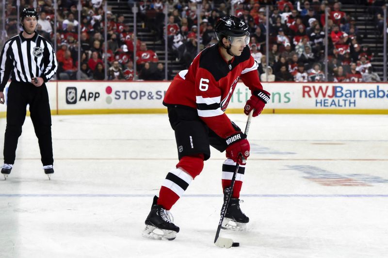 Nov 10, 2023; Newark, New Jersey, USA; New Jersey Devils defenseman John Marino (6) skates with the puck against the Washington Capitals during the second period at Prudential Center. Mandatory Credit: John Jones-USA TODAY Sports