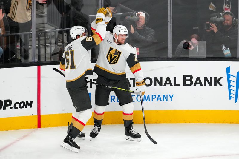 Oct 25, 2024; Las Vegas, Nevada, USA; Vegas Golden Knights center Ivan Barbashev (49) celebrates with Vegas Golden Knights right wing Mark Stone (61) after scoring a goal against the Ottawa Senators during the second period at T-Mobile Arena. Mandatory Credit: Stephen R. Sylvanie-Imagn Images