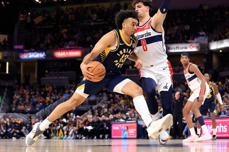 INDIANAPOLIS, INDIANA - JANUARY 10: Jordan Nwora #13 of the Indiana Pacers drives against Deni Avdija #8 of the Washington Wizards during the first half at Gainbridge Fieldhouse on January 10, 2024 in Indianapolis, Indiana. NOTE TO USER: User expressly acknowledges and agrees that, by downloading and or using this photograph, User is consenting to the terms and conditions of the Getty Images License Agreement. (Photo by Justin Casterline/Getty Images)