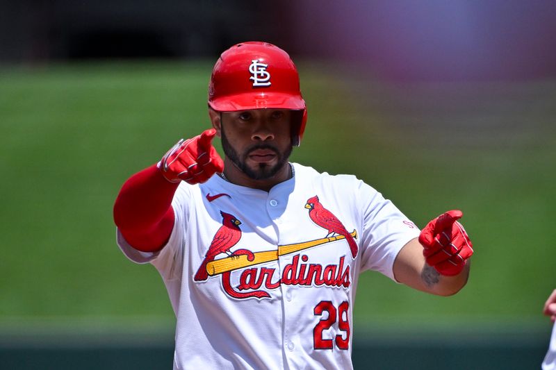 Jul 31, 2024; St. Louis, Missouri, USA;  St. Louis Cardinals right fielder Tommy Pham (29) reacts after hitting a single against the Texas Rangers during the second inning at Busch Stadium. Mandatory Credit: Jeff Curry-USA TODAY Sports