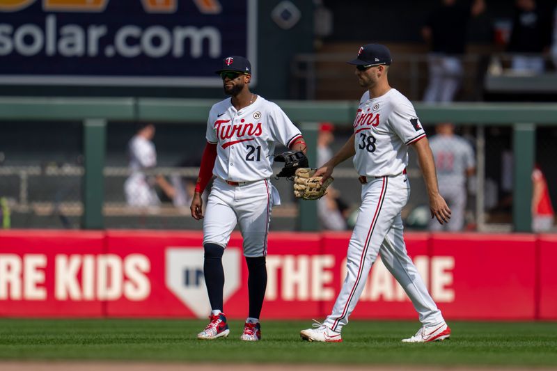 Sep 15, 2024; Minneapolis, Minnesota, USA; Minnesota Twins center fielder Willi Castro (21) and right fielder Matt Wallner (38) celebrate after defeating the Cincinnati Reds at Target Field. Mandatory Credit: Jesse Johnson-Imagn Images