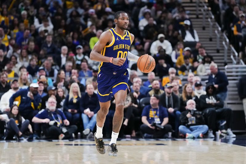 INDIANAPOLIS, INDIANA - FEBRUARY 08: Jonathan Kuminga #00 of the Golden State Warriors dribbles the ball in the third quarter against the Indiana Pacers at Gainbridge Fieldhouse on February 08, 2024 in Indianapolis, Indiana. NOTE TO USER: User expressly acknowledges and agrees that, by downloading and or using this photograph, User is consenting to the terms and conditions of the Getty Images License Agreement. (Photo by Dylan Buell/Getty Images)