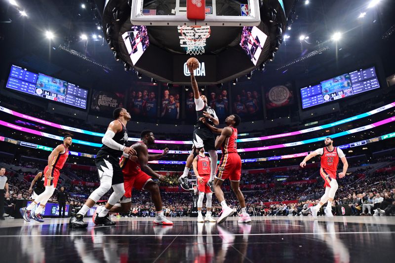 LOS ANGELES, CA - FEBRUARY 7: Norman Powell #24 of the LA Clippers shoots the ball during the game against the New Orleans Pelicans on February 7, 2024 at Crypto.Com Arena in Los Angeles, California. NOTE TO USER: User expressly acknowledges and agrees that, by downloading and/or using this Photograph, user is consenting to the terms and conditions of the Getty Images License Agreement. Mandatory Copyright Notice: Copyright 2024 NBAE (Photo by Adam Pantozzi/NBAE via Getty Images)