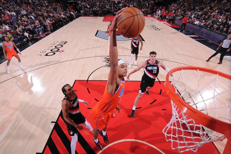 PORTLAND, OR - NOVEMBER 1: Ousmane Dieng #13 of the Oklahoma City Thunder dunks the ball during the game against the Portland Trail Blazers on November 1, 2024 at the Moda Center Arena in Portland, Oregon. NOTE TO USER: User expressly acknowledges and agrees that, by downloading and or using this photograph, user is consenting to the terms and conditions of the Getty Images License Agreement. Mandatory Copyright Notice: Copyright 2024 NBAE (Photo by Cameron Browne/NBAE via Getty Images)