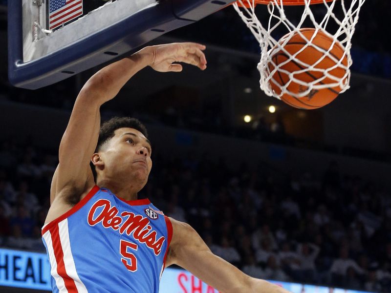 Dec 3, 2022; Memphis, Tennessee, USA; Mississippi Rebels guard James White (5) dunks during the second half against the Memphis Tigers at FedExForum. Mandatory Credit: Petre Thomas-USA TODAY Sports