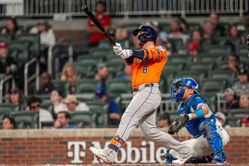 Sep 13, 2025; Cumberland, Georgia, USA; Houston Astros first baseman Christian Walker (8) watches the ball after hitting a two run home run against the Atlanta Braves during the third inning at Truist Park. Mandatory Credit: Dale Zanine-Imagn Images