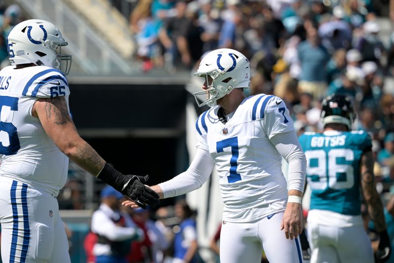 Indianapolis Colts place kicker Matt Gay (7) is congratulated by guard Josh Sills (65) after kicking a field goal during the first half of an NFL football game against the Jacksonville Jaguars, Sunday, Oct. 15, 2023, in Jacksonville, Fla. (AP Photo/Phelan M. Ebenhack)